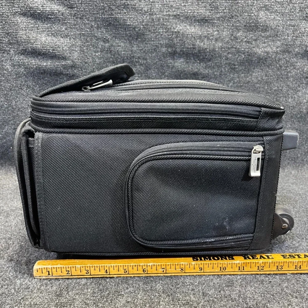 US Luggage New York Black Ballistic Nylon Rolling Catalog Case Wheeled Briefcase